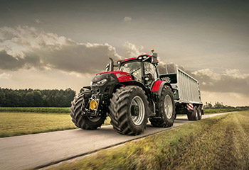 Case IH tractor while driving on bicycle path