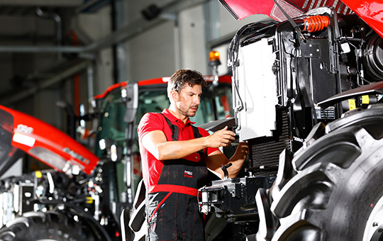 Service in agricultural machinery workshop on Case IH tractor