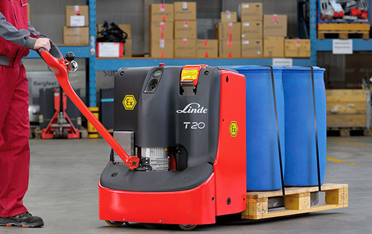 Man pushing dangerous goods with Linde T20 lift truck