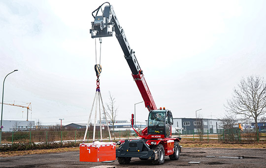 Red Magni telescopic handler lifts load