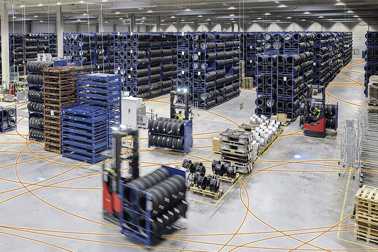 Warehouse with high rack tires intralogistics and Linde forklift trucks