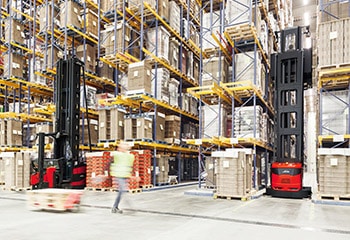 Linde warehouse navigation guides forklifts safely through narrow aisle warehouses