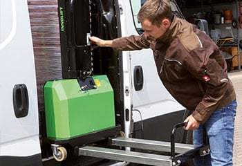 Man Innolift truck mounted forklift truck transporter green brown jacket