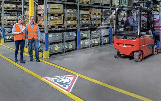 Pair of employees warned about Linde forklift by TruckSpot